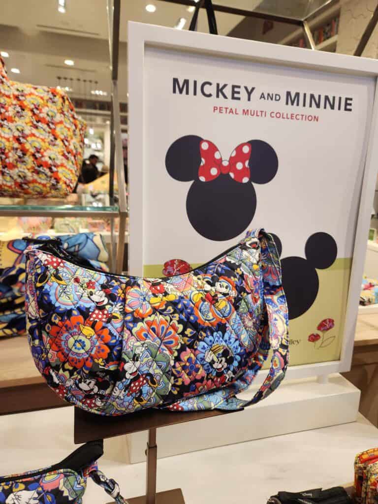 Mickey and Minnie floral bag with polka dot bow, part of the Disney x Vera Bradley Petal Multi Colle.