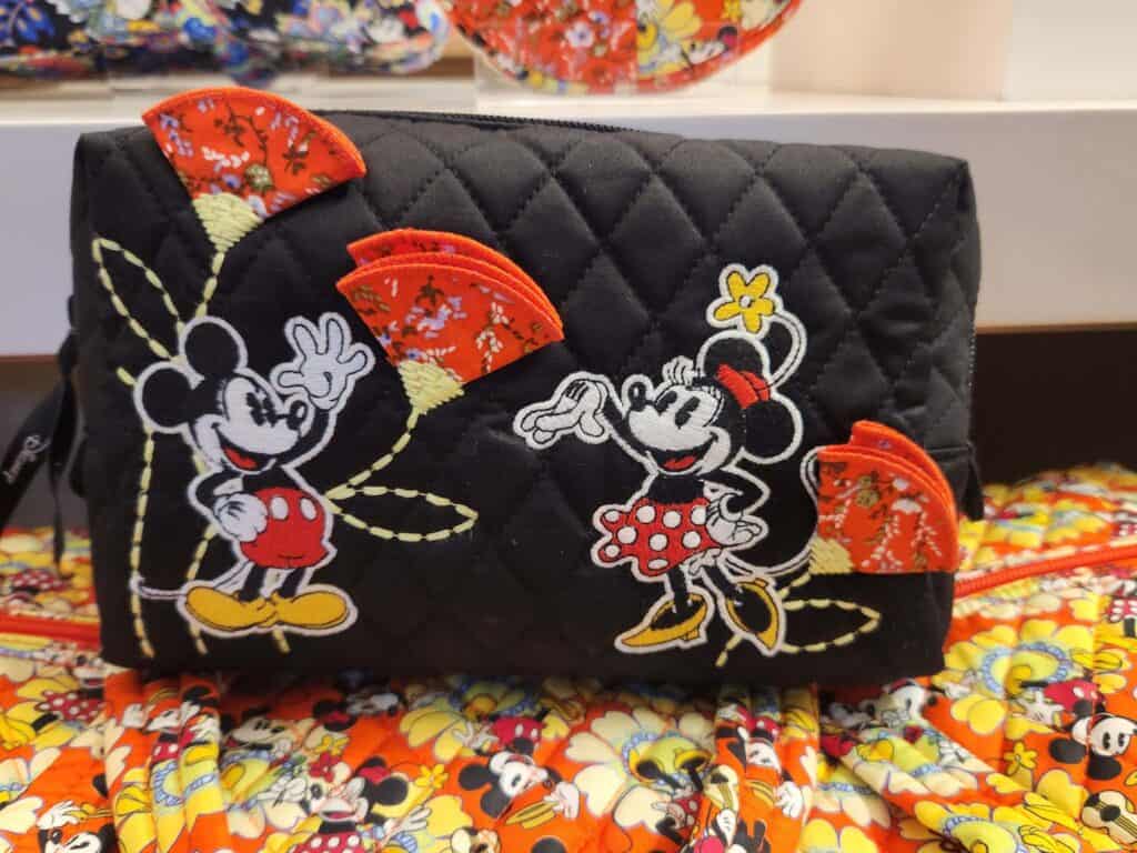 Mickey and Minnie Mouse on a quilted black bag with floral accents from Disney x Vera Bradley.