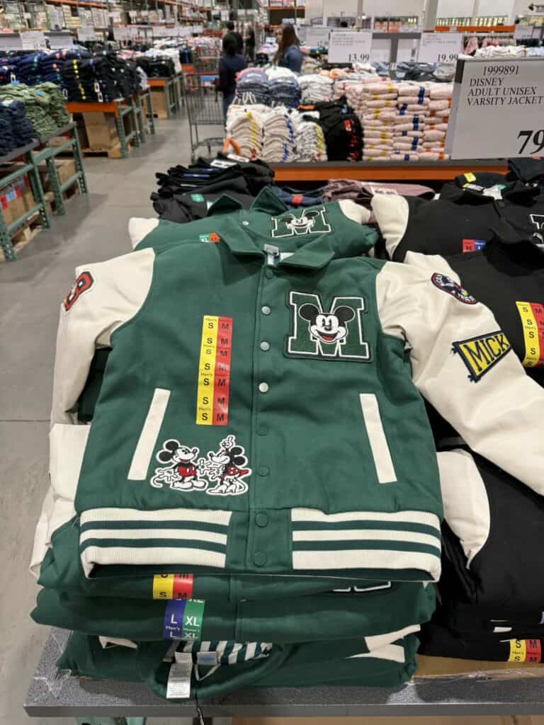 Disney varsity jacket featuring Mickey Mouse and sports-themed patches.