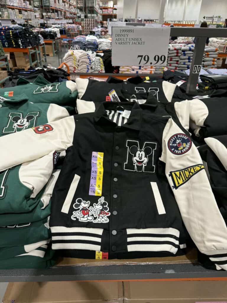 Disney adult varsity jacket with Mickey Mouse patches and colorful details.