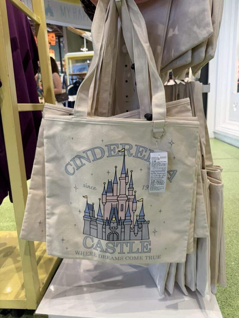 Cinderella Castle tote bag with "since 1955" and "where dreams come true" text.