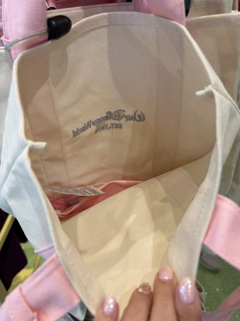 Stylish Disney tote bag with pink accents and spacious interior. Perfect for Disney fans and everyda.