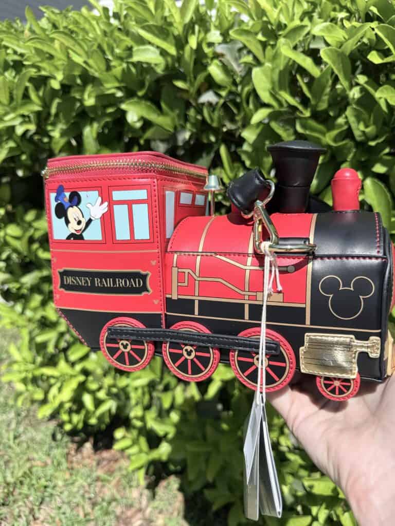 Mickey Mouse train coin bank with Disney Railroad design, perfect for Disney fans and collectors.