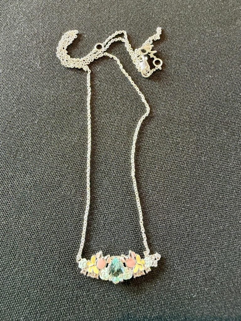 Elegant Disney princess necklace with pastel-colored charms.