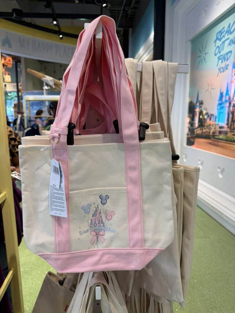 Disney-themed tote bag with pink accents and Mickey Mouse design.
