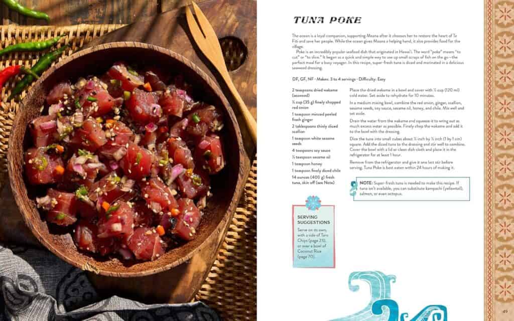 Fresh tuna poke bowl with sesame seeds and green onions, served in a wooden bowl.