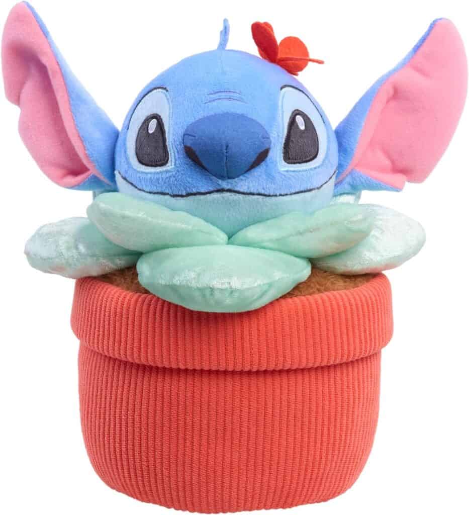 Disney Stitch plush plant in a red pot with green leaves and pink ears.
