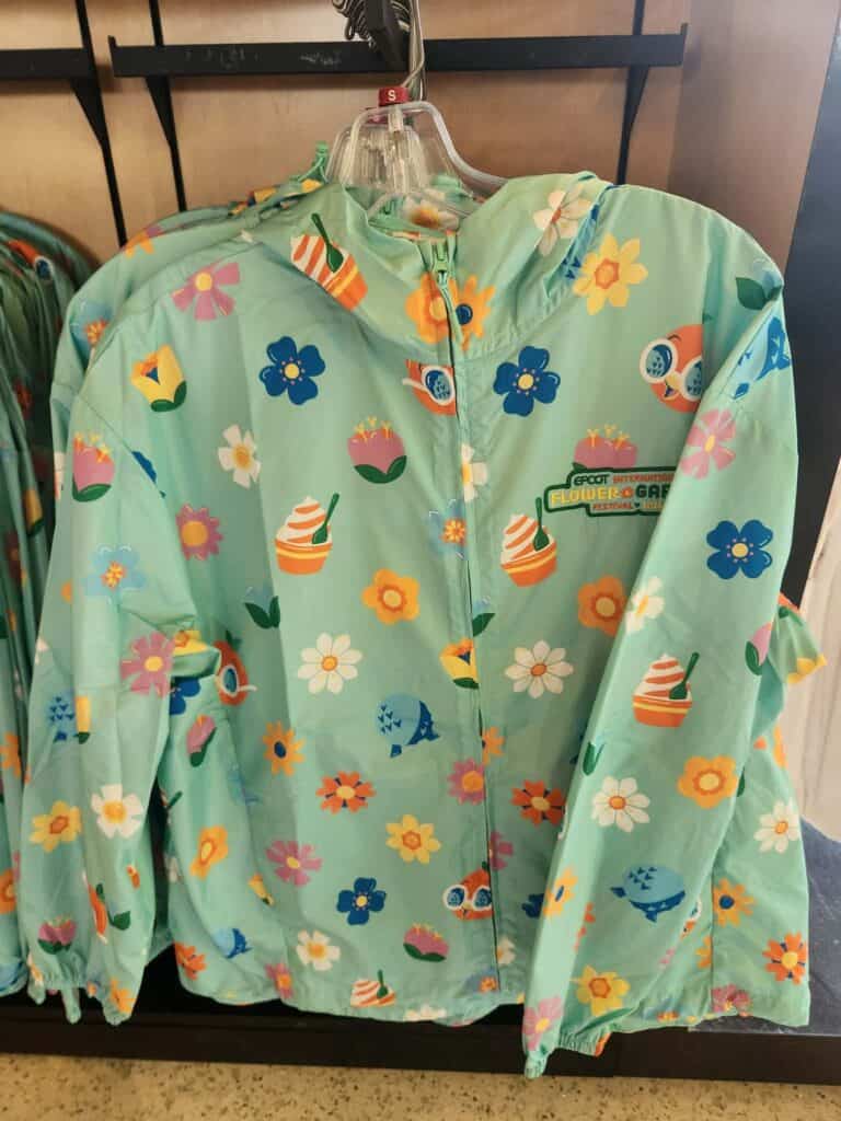 Disney-themed raincoat with colorful floral and cupcake print for kids. Perfect for spring and rainy.