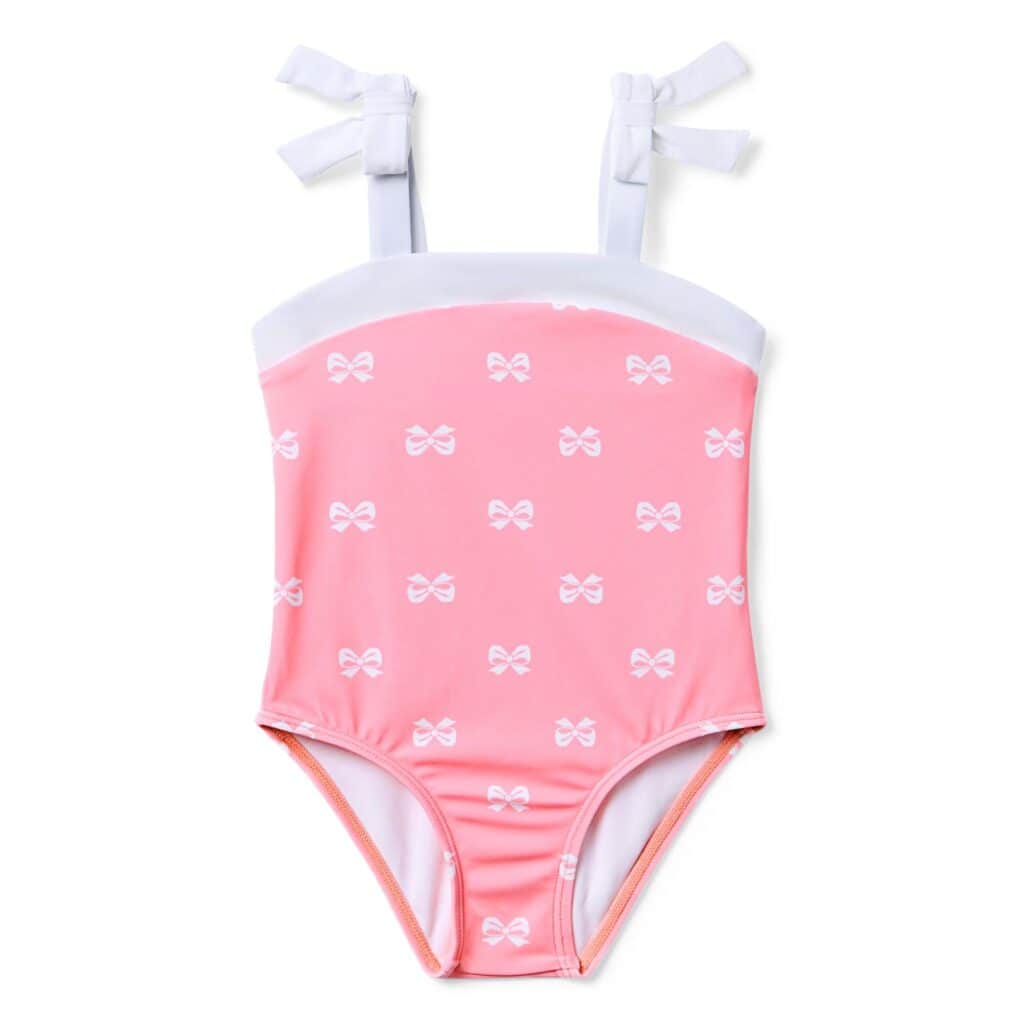 Adorable pink bow-patterned mommy and me swimsuit for kids and moms.