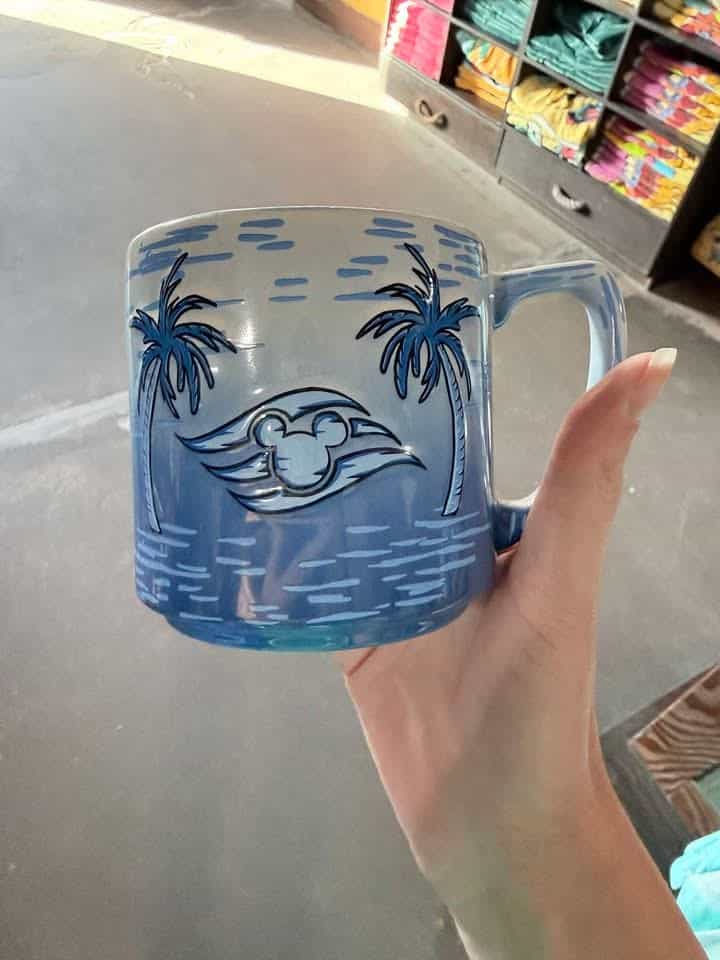 Blue ceramic mug with mermaid face and palm trees design, perfect for Disney fans.