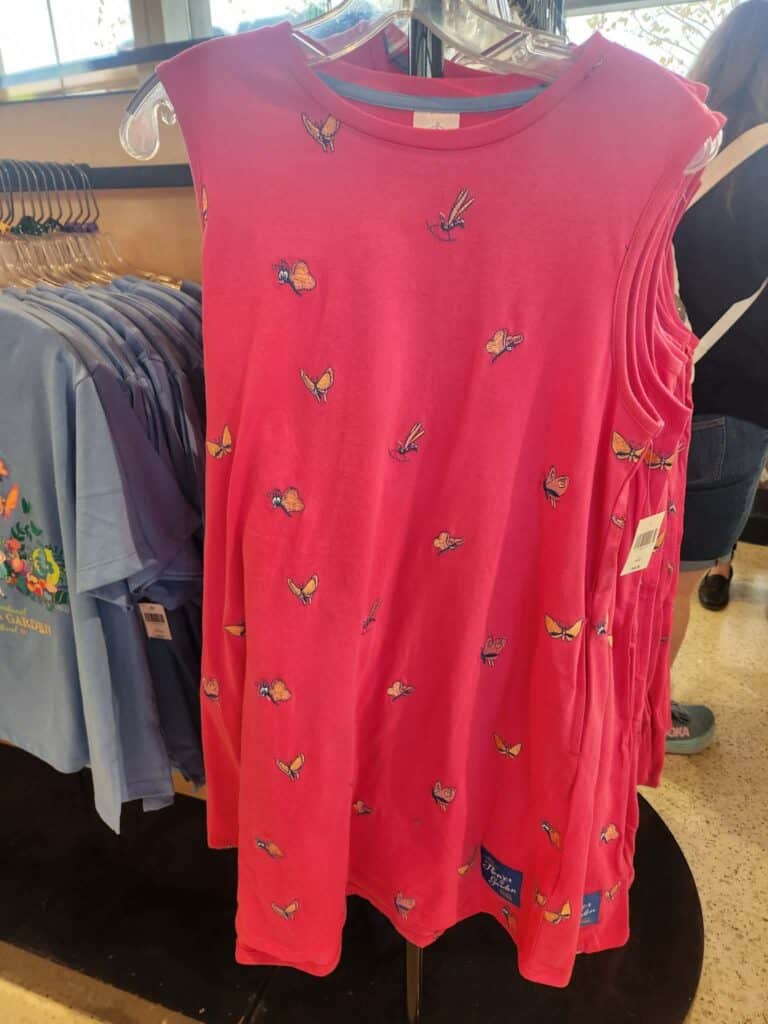 Pink Disney dress with butterfly and Minnie Mouse embroidery, perfect for fans of Disney fashion.