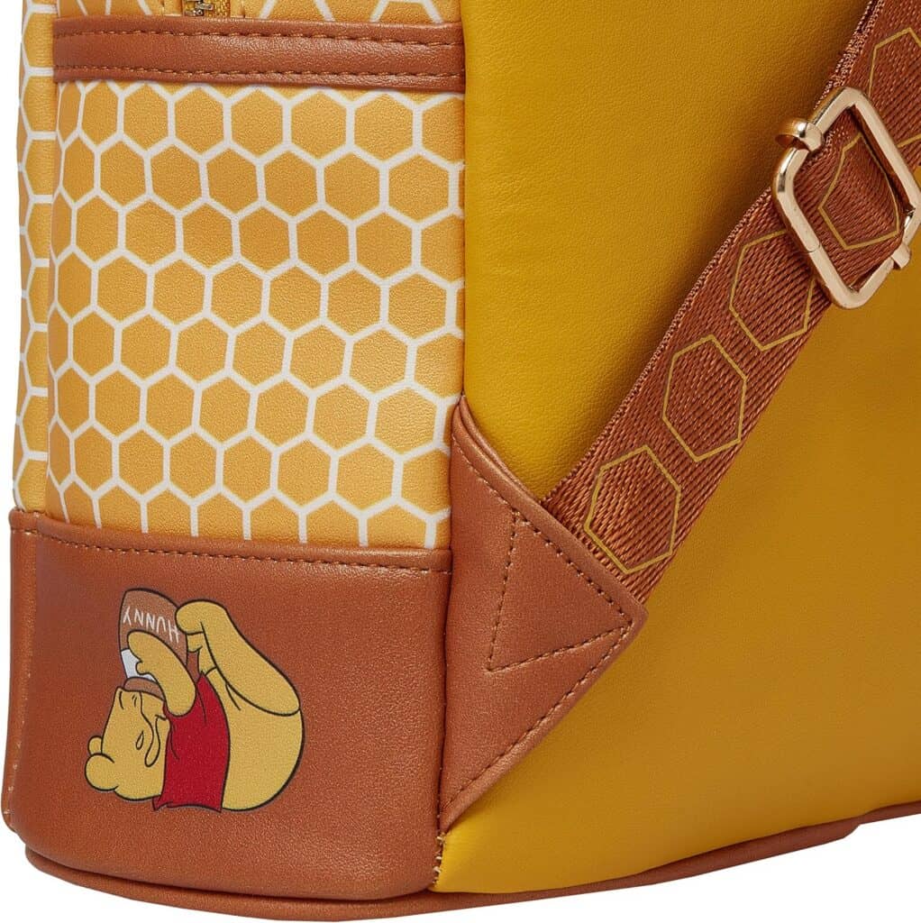 Colorful Disney Hunny Backpack with honeycomb pattern and Winnie the Pooh illustration.