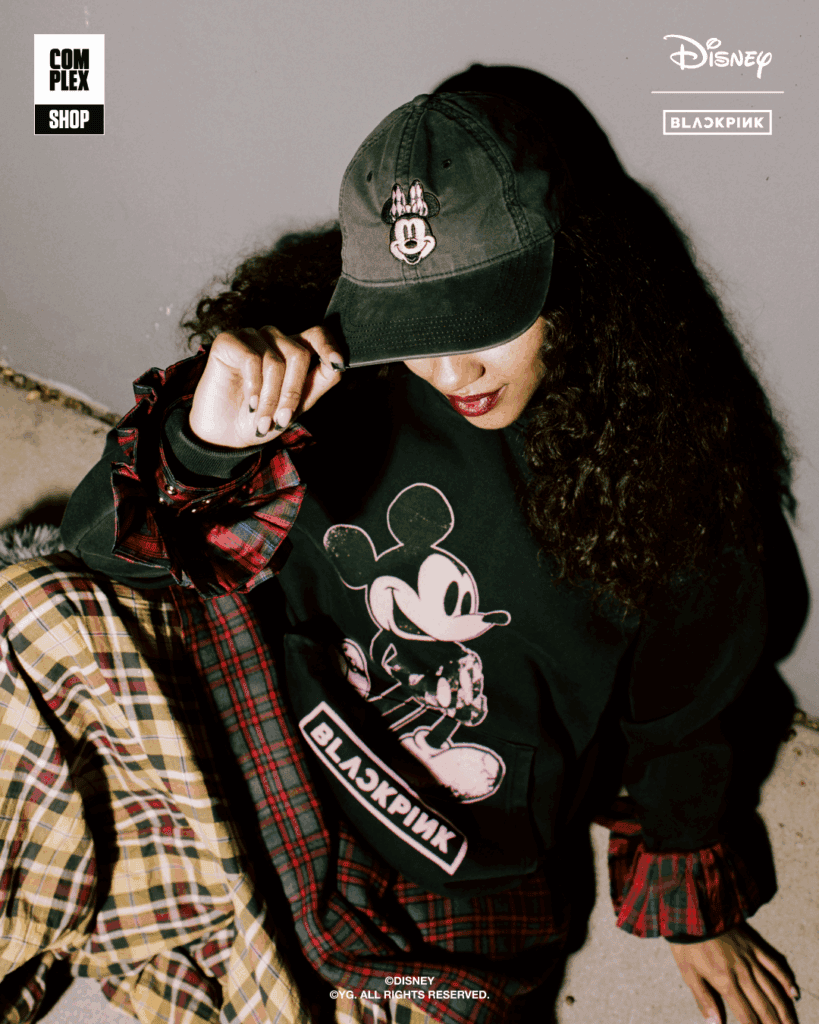 Black Mickey Mouse sweatshirt with BLACKPINK logo and cap featuring Mickey Mouse patch.