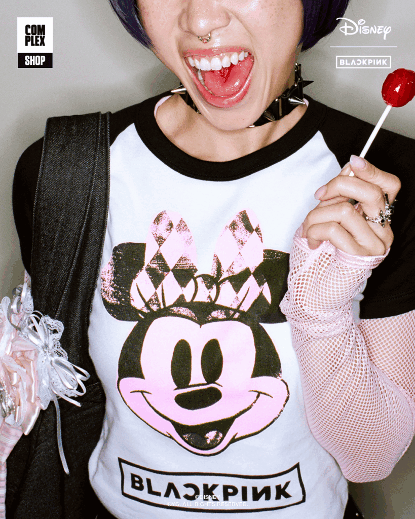 Woman wearing Minnie Mouse x BLACKPINK themed T-shirt with punk-inspired accessories.