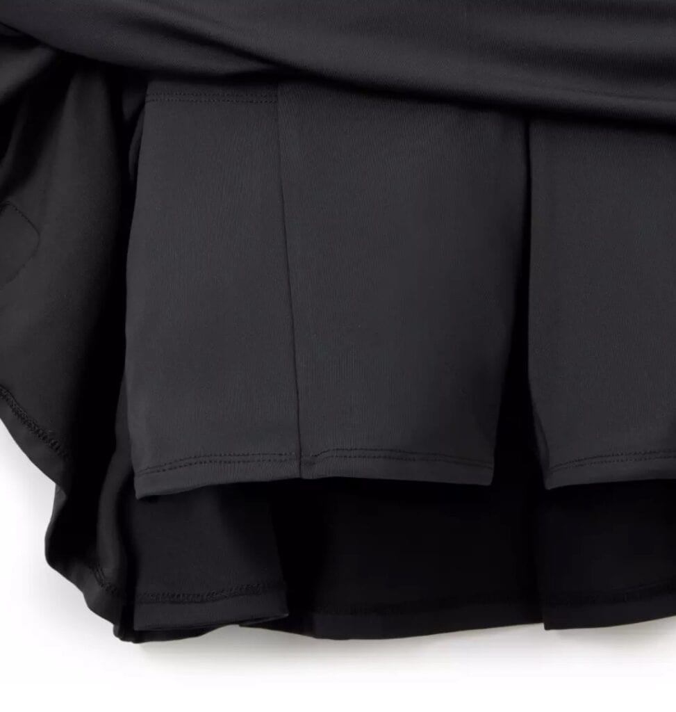 Black layered skirt with ruffle details and smooth fabric, perfect for stylish Disney-inspired outfi.