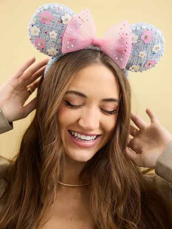 Disney Mouse Ears headband with pink bow, decorated with flowers and beads, perfect for Disney fans.
