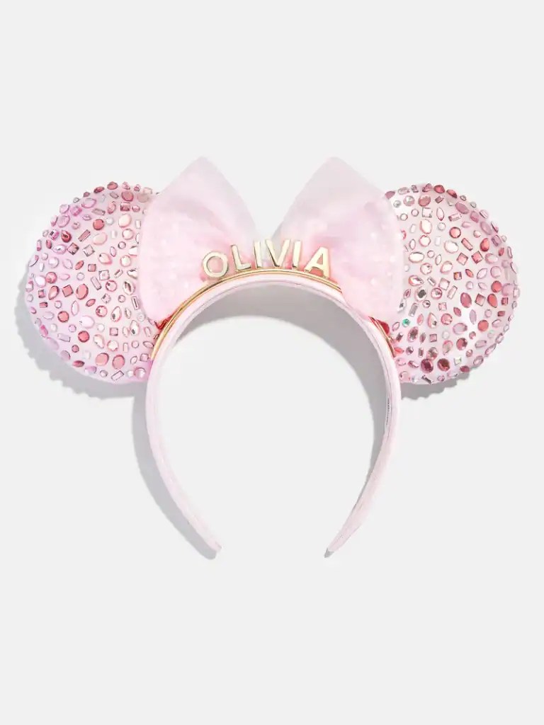 Pink Minnie Mouse ears headband with rhinestones and bow, personalized with "Olivia".