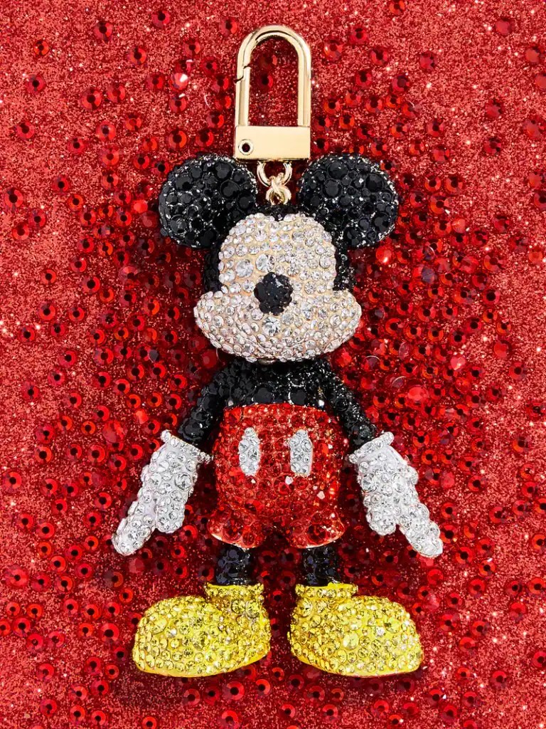 Sparkling Mickey Mouse keychain with rhinestones on red glitter background.