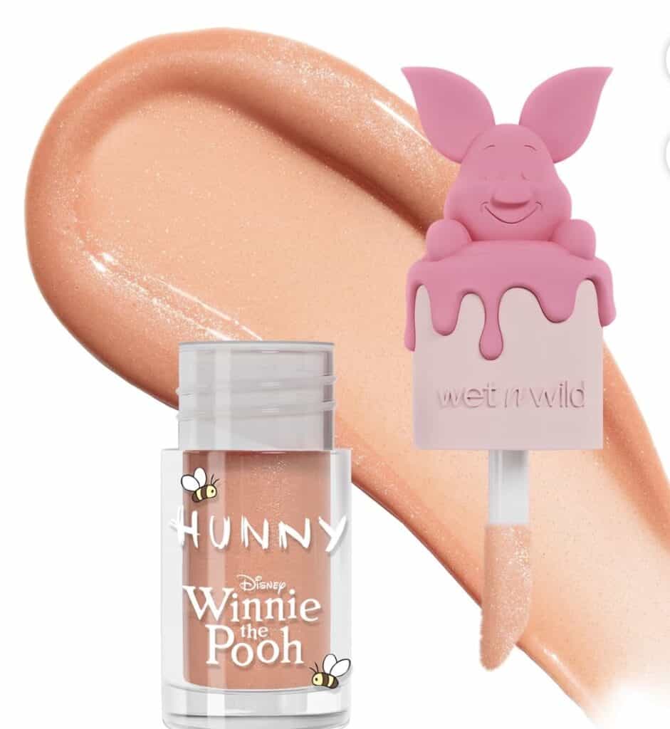 Winnie the Pooh lip gloss with piglet topper, Disney-inspired makeup product.