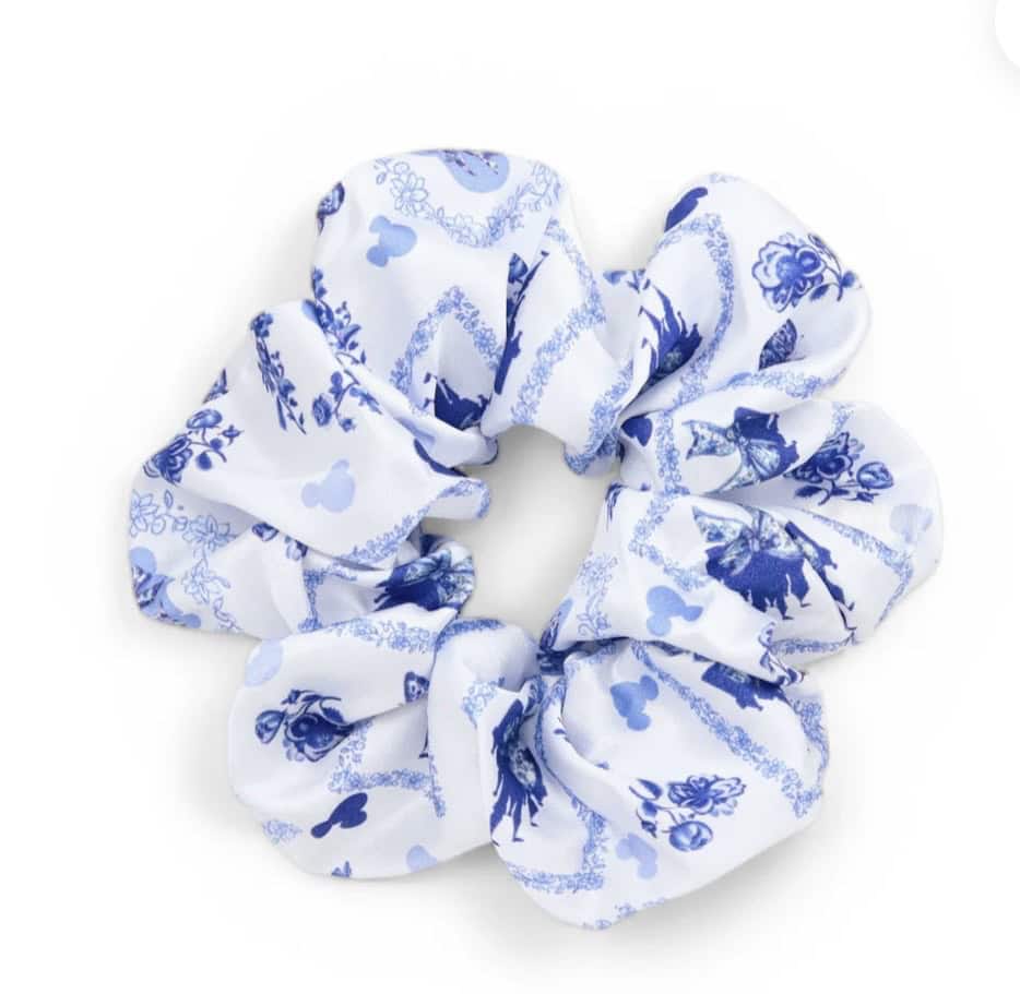 White and blue floral fabric scrunchie for hair styling.