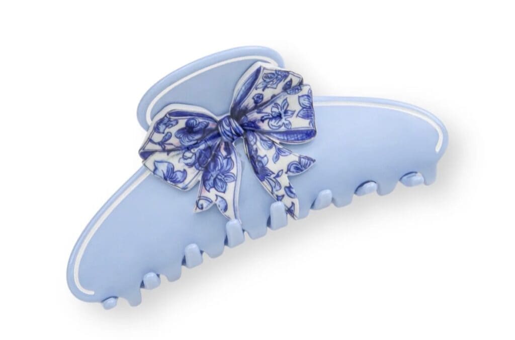 Blue hair claw with floral bow, perfect for Disney-inspired hairstyles and accessories.