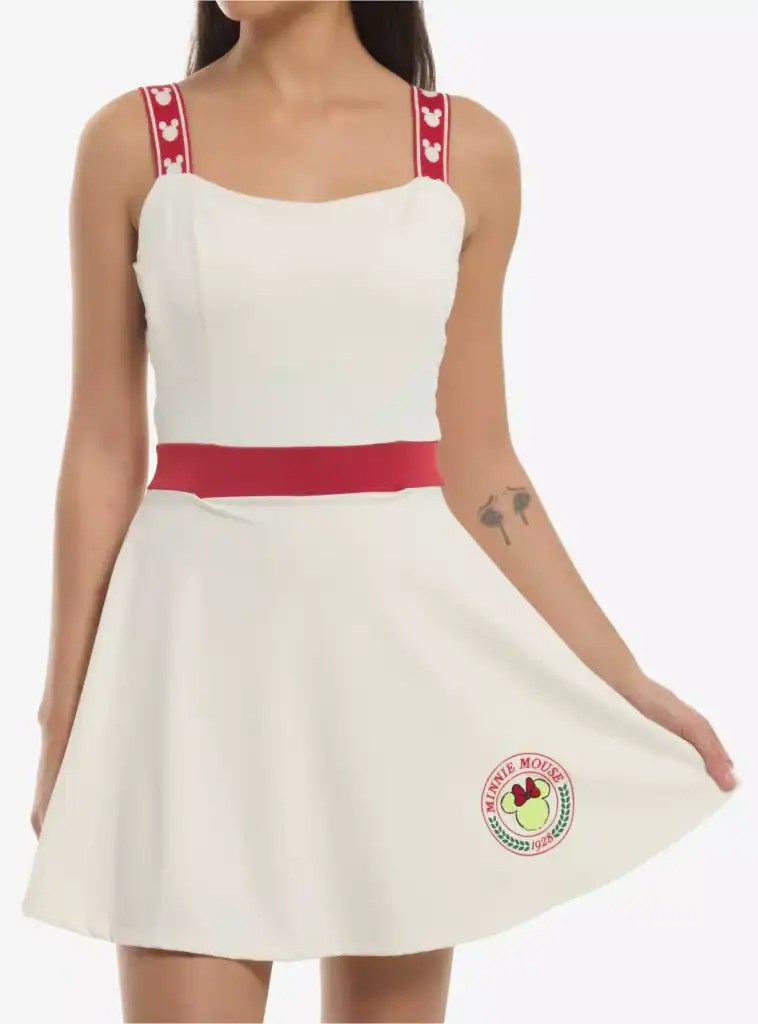 White dress with red heart-embellished straps and a pink waistband, Disney-inspired fashion piece.