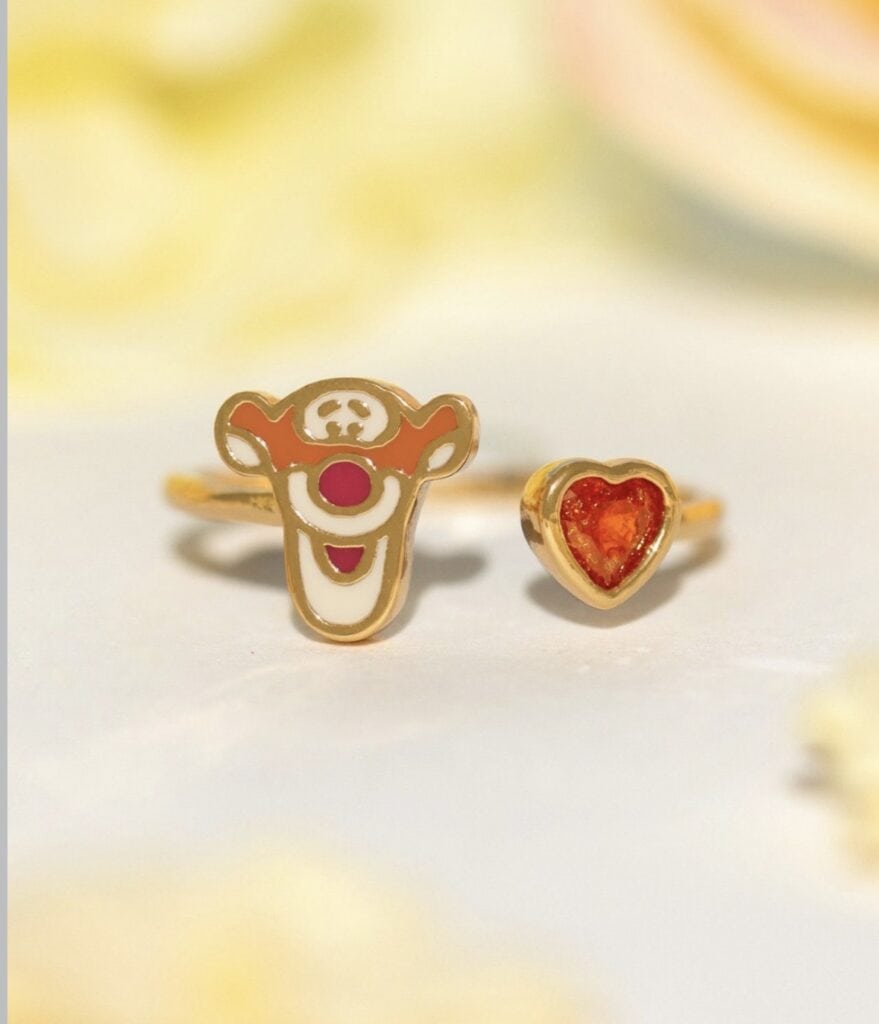 Enamel ring featuring a Disney character face and a red heart-shaped gem.