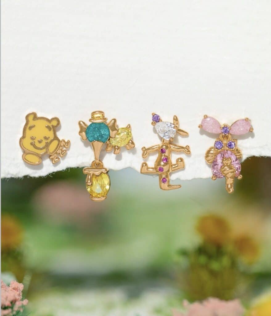 Cute Winnie the Pooh and Disney character jewelry charms with colorful gemstones.