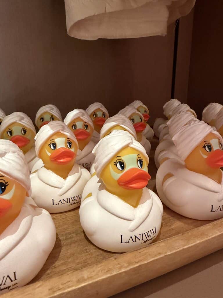 Duck rubber toys with towels, perfect for bath decor or playful accessories.