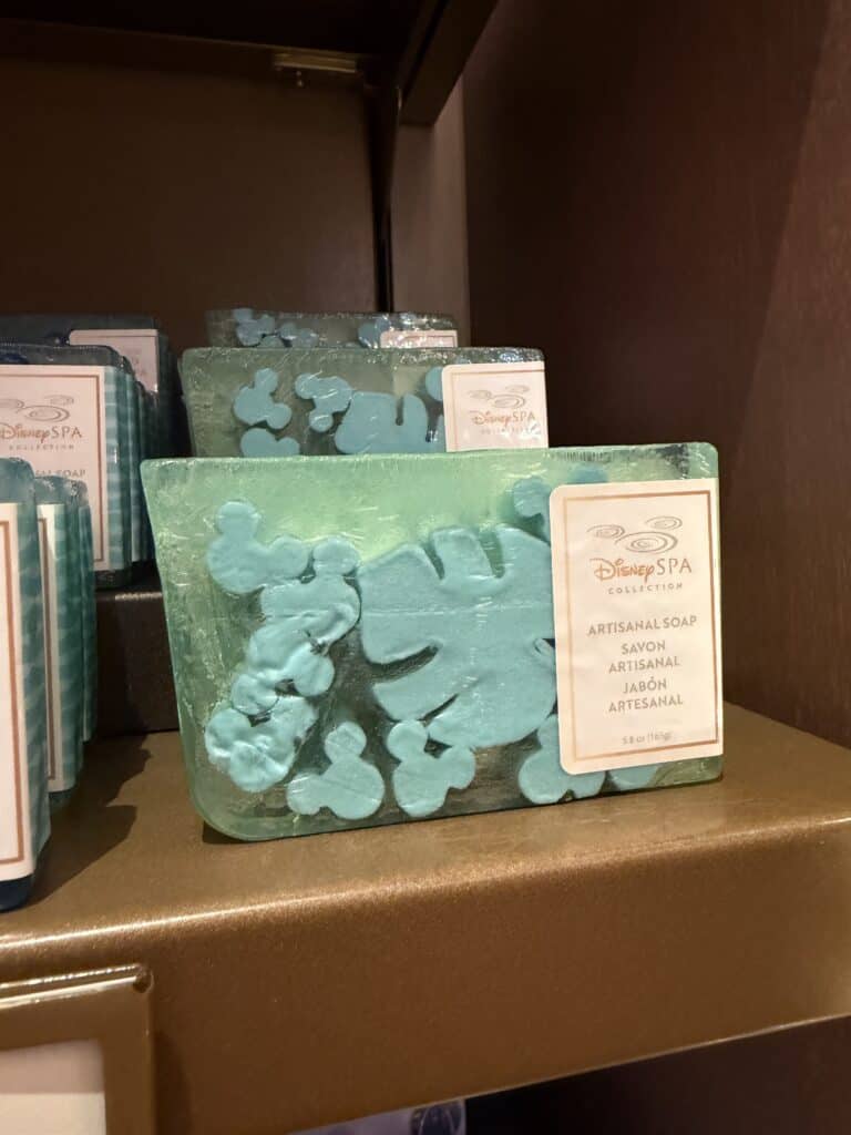 Disney Spa artisanal soap with Mickey Mouse design on a shelf.
