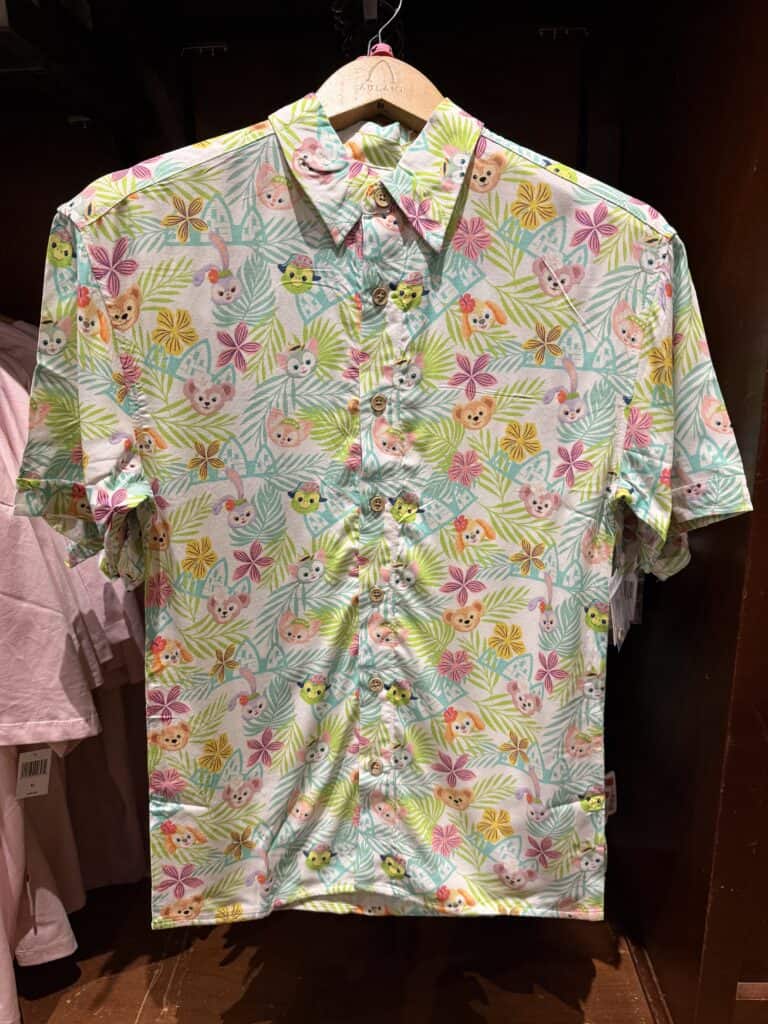 Bright floral shirt with cute animal and butterfly print, perfect for Disney fans.