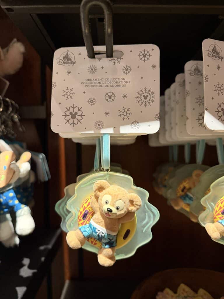Cute Disney plush ornament featuring a bear in summer attire.