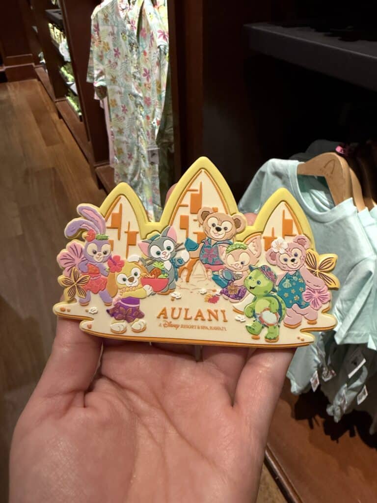 Aulani Disney Resort souvenir magnet featuring beloved Disney characters in a colorful, playful desi.