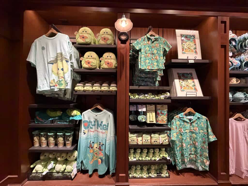 Disney-themed T-shirts and plush toys on display at The Disney Fashionista store.