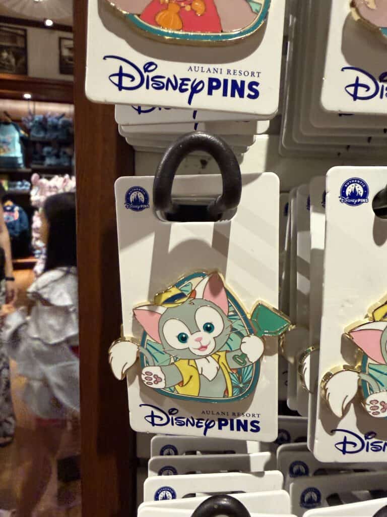 Disney Pins character keychain featuring a cute, colorful cartoon cat from Disney.