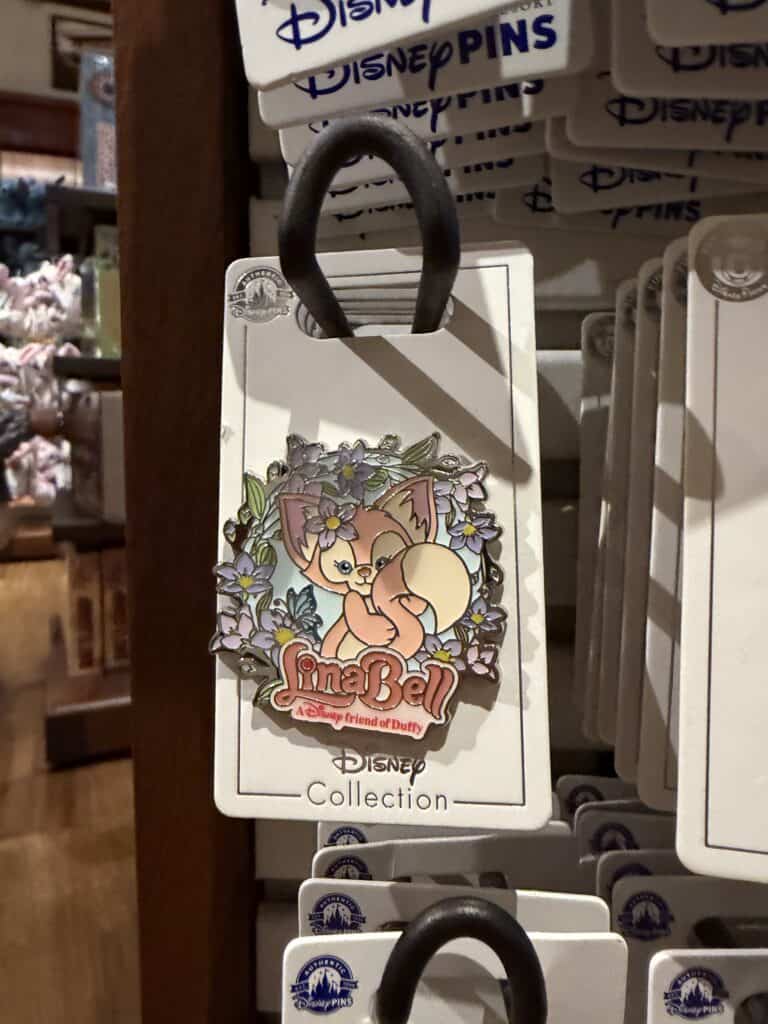 Adorable llama-shaped Disney keychain with floral design, perfect for Disney fans.
