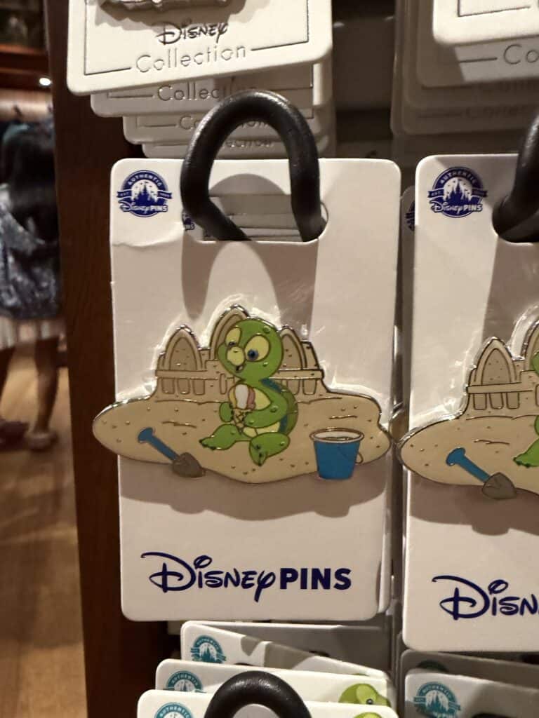 Baby Yoda (Grogu) Disney pin with a watering can and shovel, perfect for Disney fans and collectors.