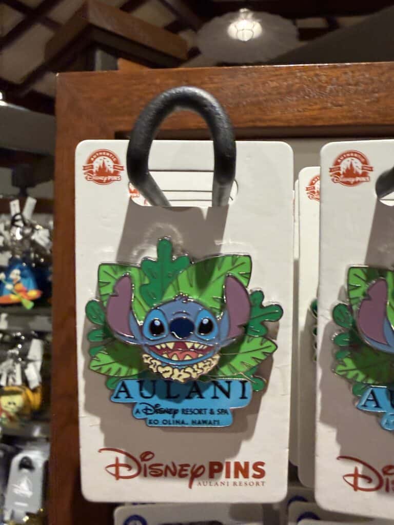 Disney Stitch Hawaiian enamel pin with tropical leaves, perfect for Disney fans.
