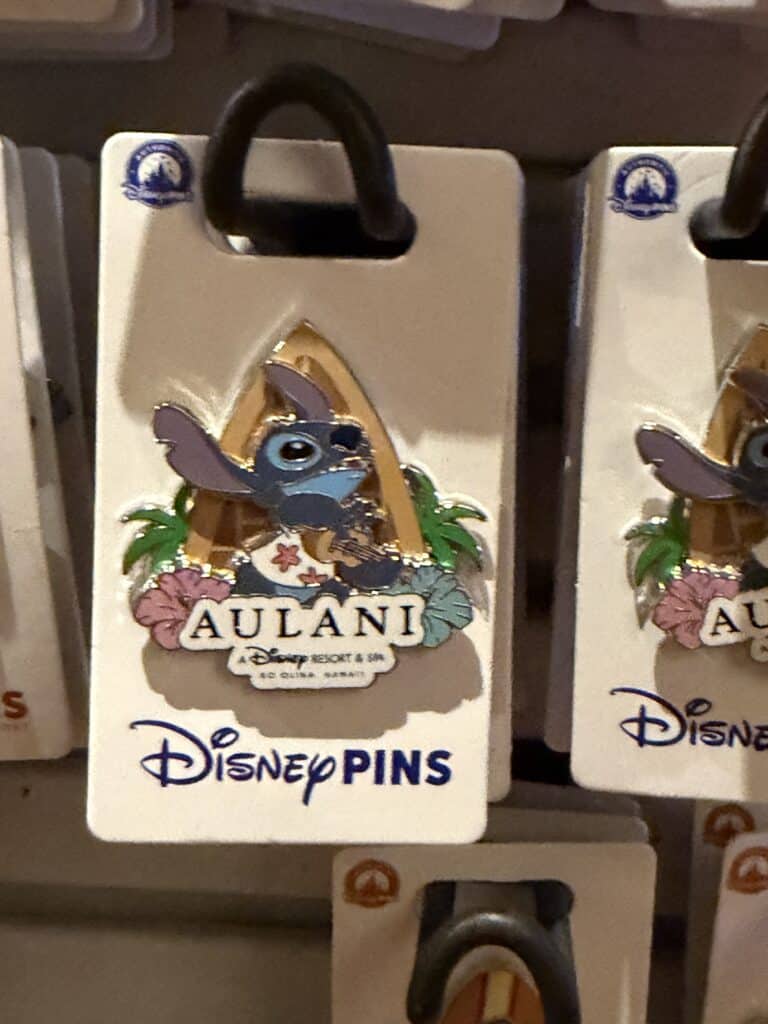 Disney Stitch Aulani Resort enamel pin with tropical design and colorful details.
