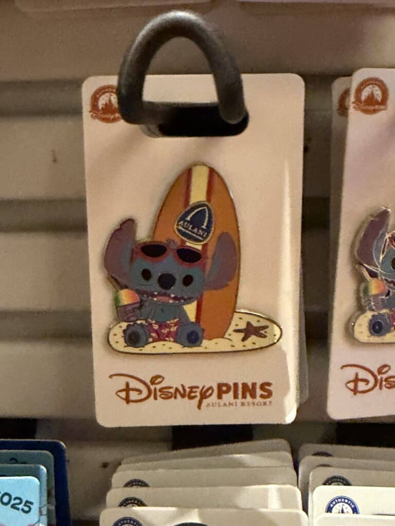 Disney Stitch pin with surfboard design, perfect for Disney fans.