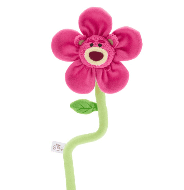 Soft pink plush flower with a cute Disney character face in the center, attached to a green stem and.