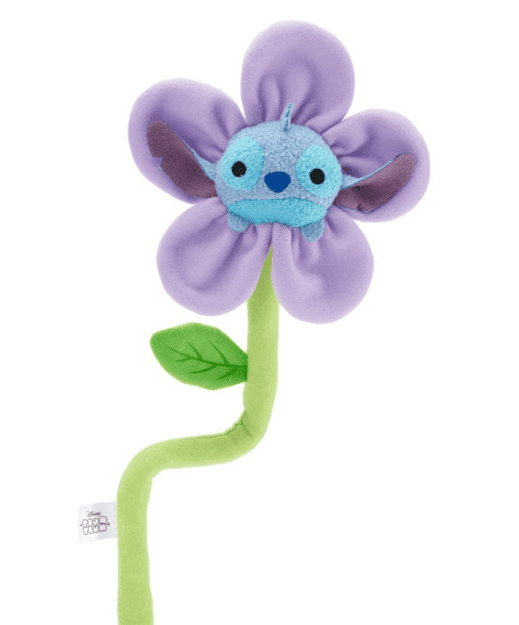 Cute Stitch plush toy as a purple flower with green stem and leaf, perfect for Disney fans.