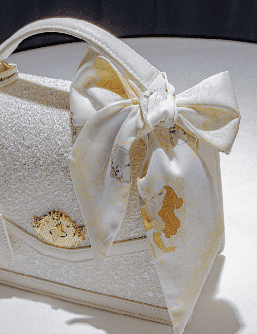 Elegant Disney princess-themed handbag with a large bow detail.