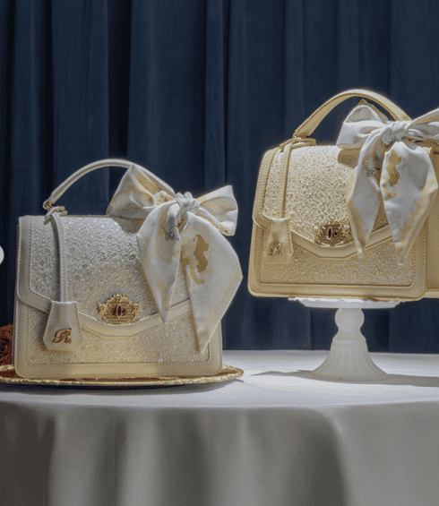 Luxury Disney fashion accessories featuring intricate details and shimmering finishes.