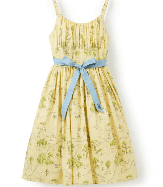 Winnie the Pooh themed dress with blue ribbon, perfect for Disney fans and celebrating 100 years of.