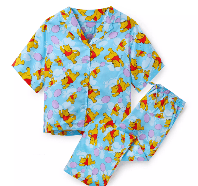 Winnie the Pooh pajama set for kids with colorful print and playful design.