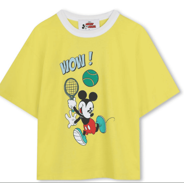 Mickey Mouse playing tennis on a yellow kids' T-shirt.