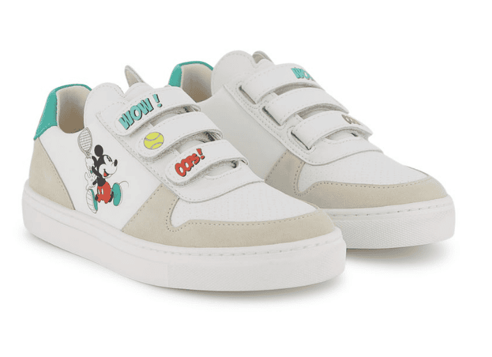 White kids sneakers featuring Mickey Mouse and colorful comic-style accents.