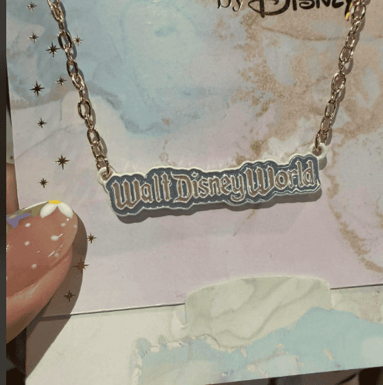 Walt Disney World themed necklace with a silver chain and logo pendant. Perfect Disney accessory for.