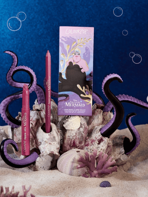 Mermaid-inspired makeup set with purple tentacles and ocean decor.